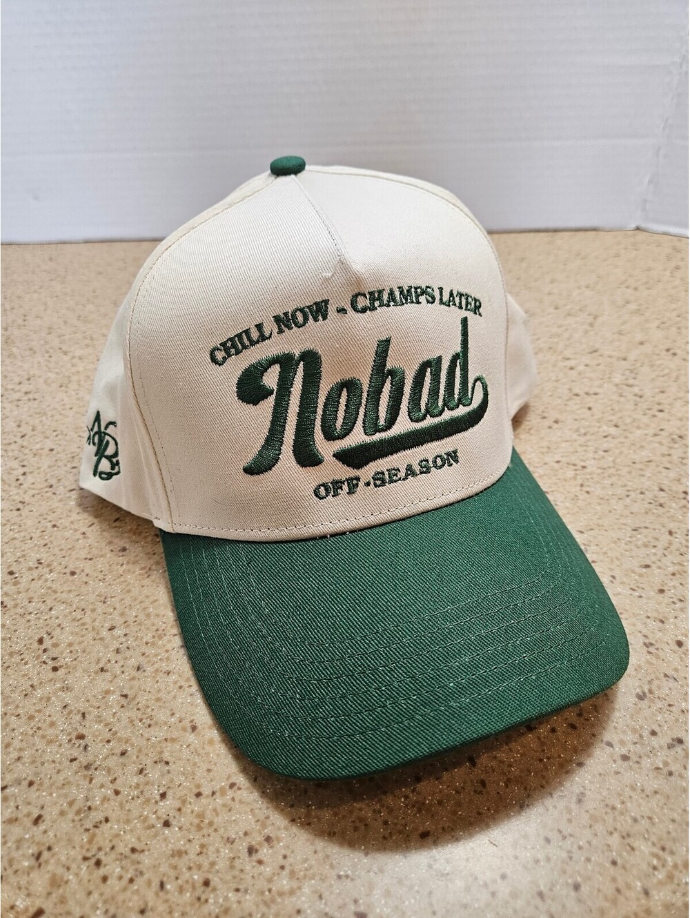 Nobad green and white snapback hat